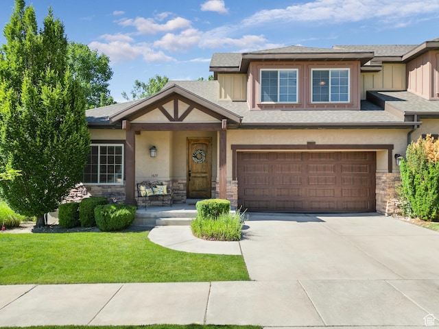 1429 E Chateau Ridge Way S, Sandy, UT 84092 - view of front facade with stone siding, concrete driveway, and stucco siding