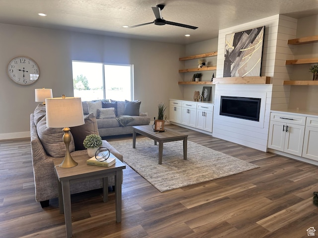 798 W Clark St N, Grantsville, UT 84029 - living area with ceiling fan, recessed lighting, dark wood-style flooring, baseboards, and a large fireplace