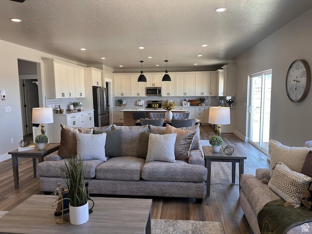 798 W Clark St N, Grantsville, UT 84029 - living area featuring dark wood finished floors, recessed lighting, and baseboards