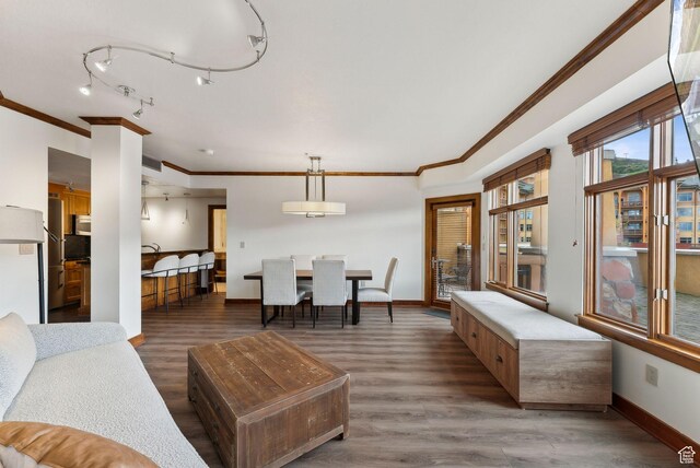3720 N Sundial Ct Unit C207, Park City, UT 84098 - living area with wood finished floors, baseboards, and crown molding