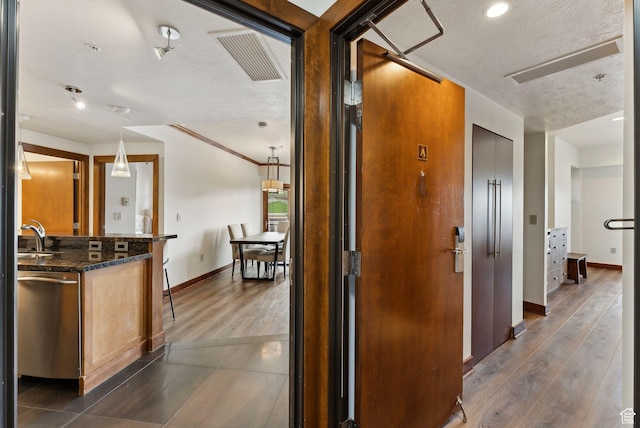 3720 N Sundial Ct Unit C207, Park City, UT 84098 - hallway featuring baseboards, dark wood finished floors, a sink, and recessed lighting