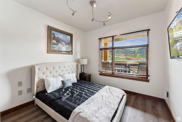 3720 N Sundial Ct Unit C207, Park City, UT 84098 - bedroom with baseboards, multiple windows, and wood finished floors