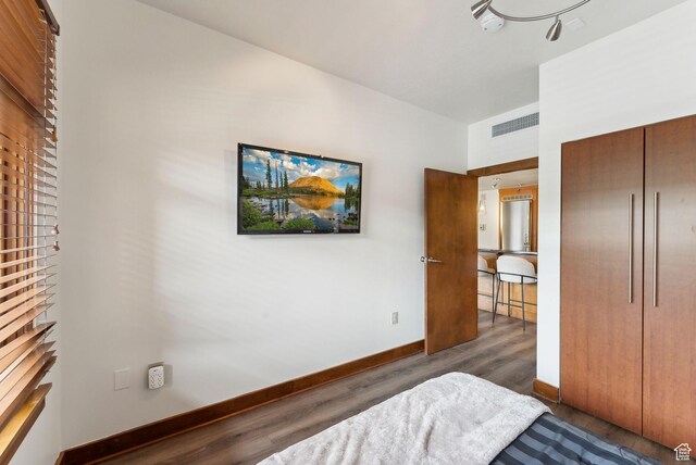 3720 N Sundial Ct Unit C207, Park City, UT 84098 - bedroom with wood finished floors, baseboards, and a closet