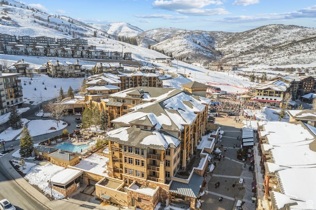 3720 N Sundial Ct Unit C207, Park City, UT 84098 - snowy aerial view with a mountain view, view of pool area, and a residential view
