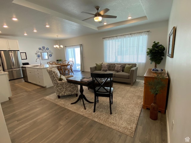 1255 S Raintree Ln, Santaquin, UT 84655 - living room with wood finished floors, a raised ceiling, a ceiling fan, a chandelier, and recessed lighting