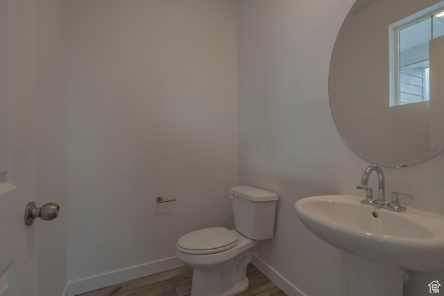 1644 N 800 W, Salem, UT 84653 - half bath with baseboards, a sink, toilet, and wood finished floors