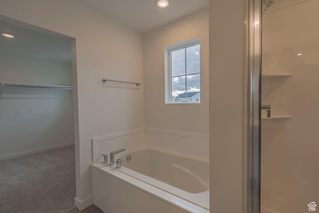 1644 N 800 W, Salem, UT 84653 - bathroom with a bath, baseboards, a walk in closet, and recessed lighting