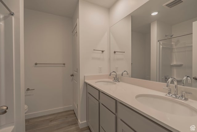 1644 N 800 W, Salem, UT 84653 - bathroom with toilet, wood finished floors, a shower, baseboards, and recessed lighting