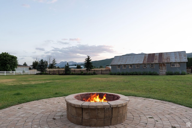 703 River Rd, Midway, UT 84049 - view of patio / terrace featuring an outdoor fire pit and a mountain view