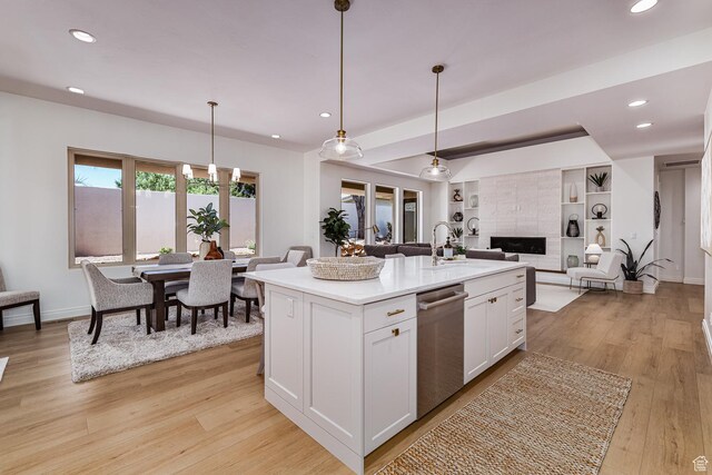 38 S 1840 W, St George, UT 84770 - kitchen with decorative light fixtures, light countertops, open floor plan, a kitchen island with sink, and white cabinets
