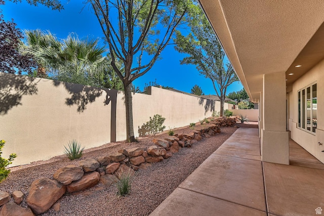 view of yard featuring a fenced backyard and a patio