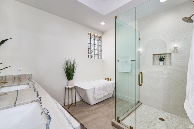 38 S 1840 W, St George, UT 84770 - full bathroom featuring a freestanding bath, double vanity, a shower stall, and baseboards