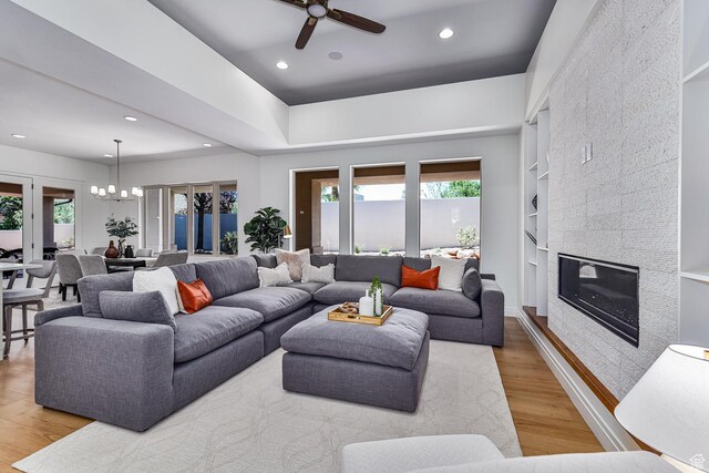 38 S 1840 W, St George, UT 84770 - living area featuring light wood-type flooring, recessed lighting, built in shelves, and a tile fireplace