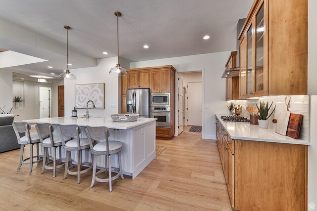38 S 1840 W, St George, UT 84770 - kitchen featuring appliances with stainless steel finishes, light countertops, glass insert cabinets, and decorative light fixtures