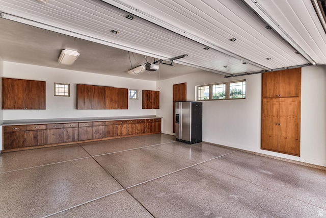 garage featuring baseboards and a garage door opener