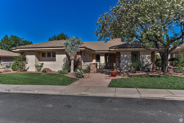 38 S 1840 W, St George, UT 84770 - ranch-style house featuring a tiled roof, fence, a front lawn, and stucco siding