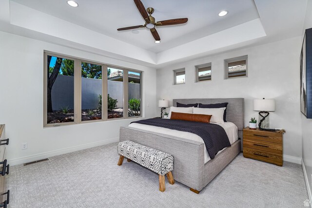 38 S 1840 W, St George, UT 84770 - bedroom featuring a tray ceiling, light colored carpet, visible vents, and baseboards