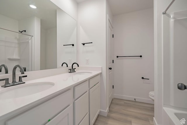 1686 N 800 W, Salem, UT 84653 - bathroom with toilet, wood finished floors, baseboards, double vanity, and recessed lighting