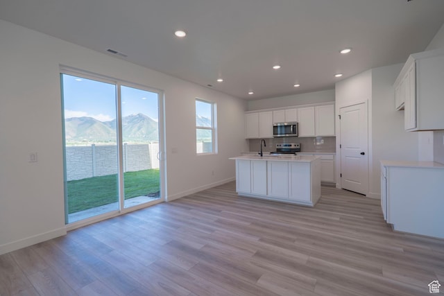 1686 N 800 W, Salem, UT 84653 - kitchen featuring appliances with stainless steel finishes, light countertops, recessed lighting, white cabinetry, and baseboards