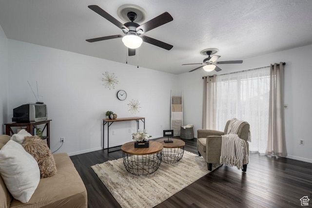 488 E 200 S Unit A3, Clearfield, UT 84015 - living area featuring a textured ceiling, baseboards, and dark wood-style flooring