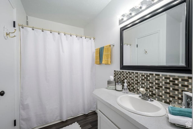 488 E 200 S Unit A3, Clearfield, UT 84015 - bathroom with decorative backsplash, wood finished floors, and vanity