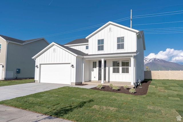 1656 N 800 W, Salem, UT 84653 - modern farmhouse style home featuring board and batten siding, a porch, concrete driveway, and an attached garage