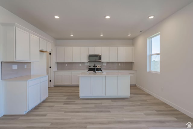 1656 N 800 W, Salem, UT 84653 - kitchen featuring stainless steel appliances, light countertops, recessed lighting, white cabinets, and decorative backsplash