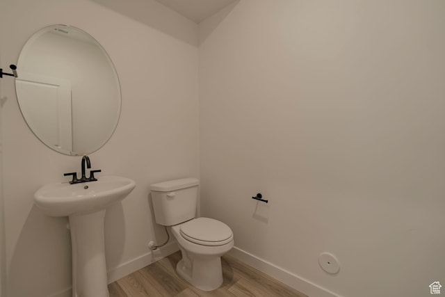 1656 N 800 W, Salem, UT 84653 - bathroom featuring wood finished floors, baseboards, toilet, and a sink