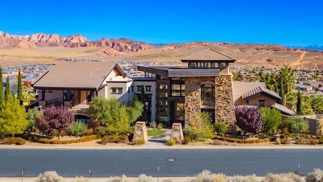 1558 N Harvard Ave, Washington, UT 84780 - view of front of house featuring stone siding and a mountain view