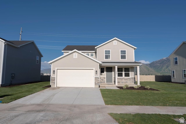 1678 N 800 W, Salem, UT 84653 - view of front of property with covered porch, a garage, driveway, stone siding, and a mountain view