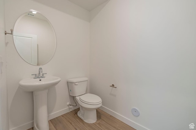 1678 N 800 W, Salem, UT 84653 - half bath featuring wood finished floors, baseboards, toilet, and a sink