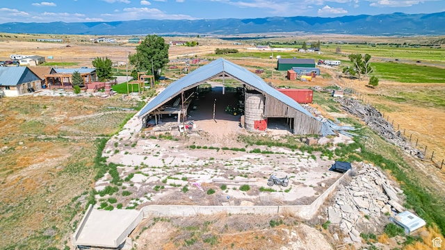 birds eye view of property with a rural view and a mountain view