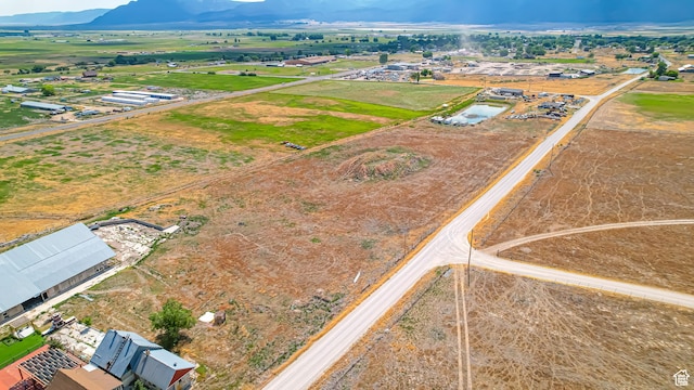 bird's eye view featuring a rural view and a mountain view