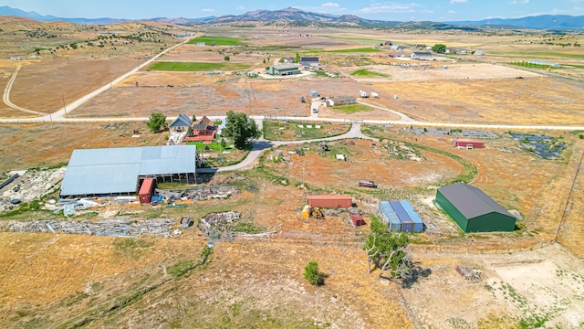 drone / aerial view featuring a rural view and a mountain view