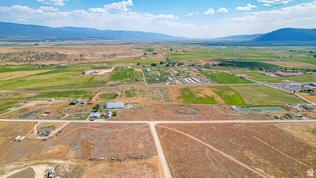 aerial view featuring a rural view and a water and mountain view