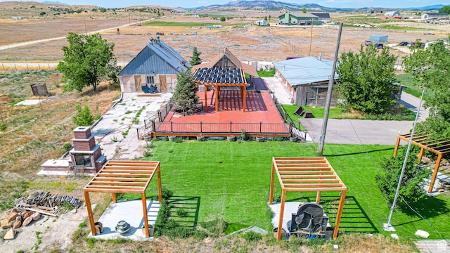 birds eye view of property featuring a mountain view