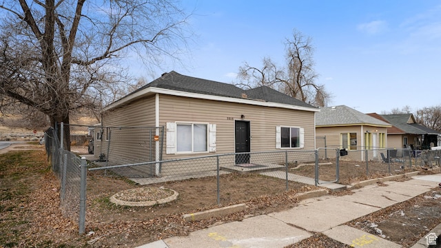 2812 S 9150 W, Magna, UT 84044 - view of front of home featuring a fenced front yard and a gate