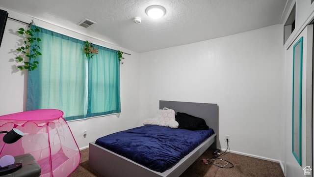 2812 S 9150 W, Magna, UT 84044 - bedroom featuring carpet, visible vents, a textured ceiling, and baseboards
