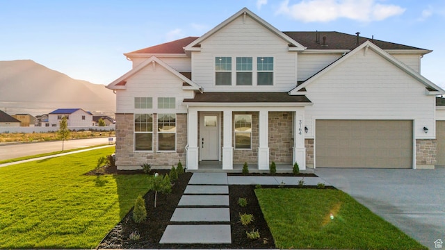 2452 W 2950 N Unit 112, Farr West, UT 84404 - craftsman inspired home with driveway, stone siding, and a front lawn