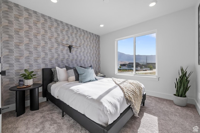 2452 W 2950 N Unit 112, Farr West, UT 84404 - carpeted bedroom featuring wallpapered walls, baseboards, a mountain view, and recessed lighting