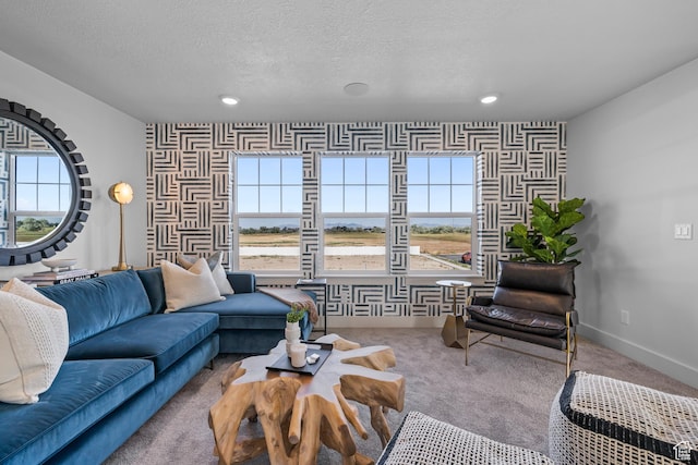2452 W 2950 N Unit 112, Farr West, UT 84404 - living area with a textured ceiling, recessed lighting, light colored carpet, an accent wall, and baseboards