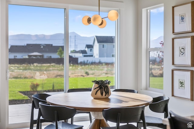 2452 W 2950 N Unit 112, Farr West, UT 84404 - dining area with a wealth of natural light and a mountain view