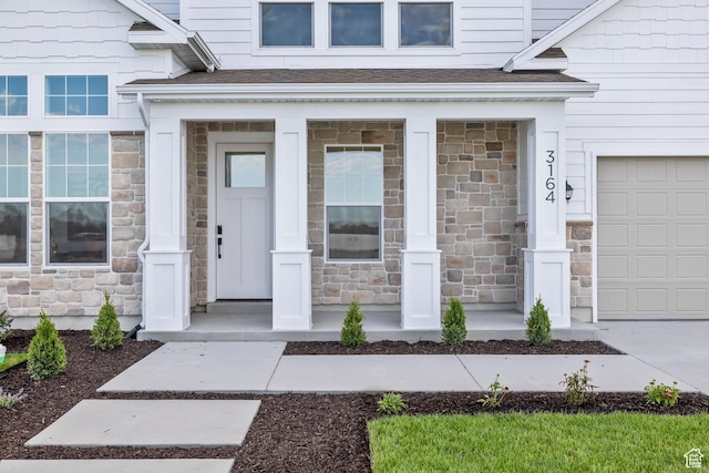 2452 W 2950 N Unit 112, Farr West, UT 84404 - view of exterior entry featuring a garage, stone siding, and a shingled roof