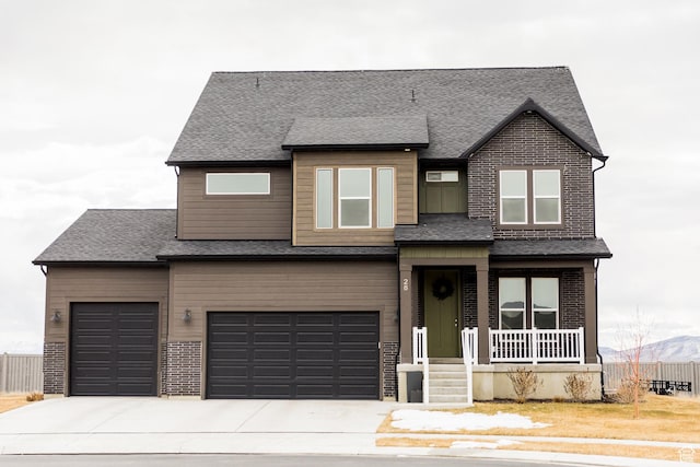 view of front of house with driveway, brick siding, and a shingled roof