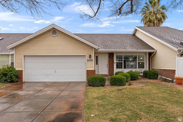 ranch-style home featuring a garage, brick siding, a front lawn, and roof with shingles
