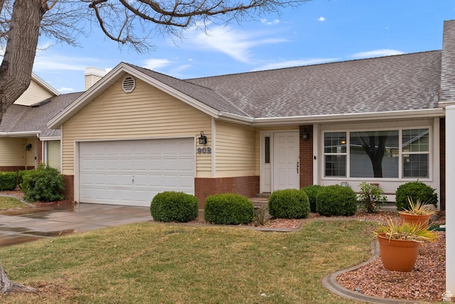 ranch-style home featuring brick siding, a chimney, an attached garage, and a front lawn
