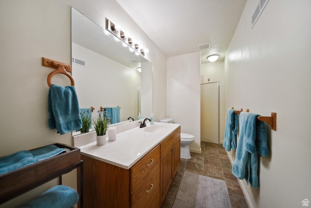 full bathroom with visible vents, vanity, and toilet