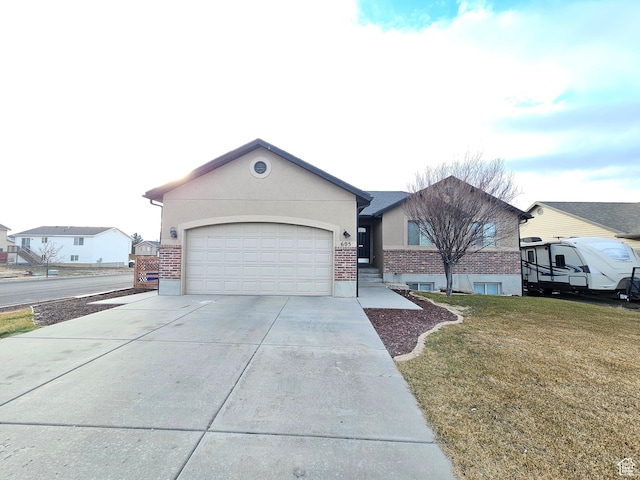 single story home featuring brick siding, driveway, an attached garage, and stucco siding