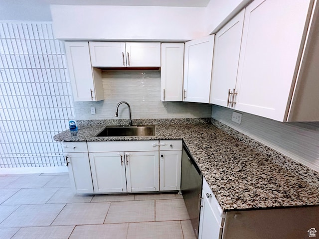 1866 W Homestead Farms Ln S Unit 1, Salt Lake City, UT 84119 - kitchen with dark stone countertops, white cabinetry, and a sink