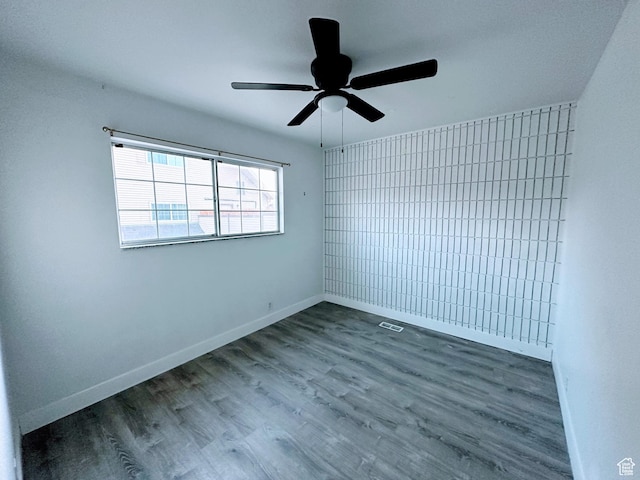 1866 W Homestead Farms Ln S Unit 1, Salt Lake City, UT 84119 - empty room featuring wood finished floors, visible vents, and baseboards